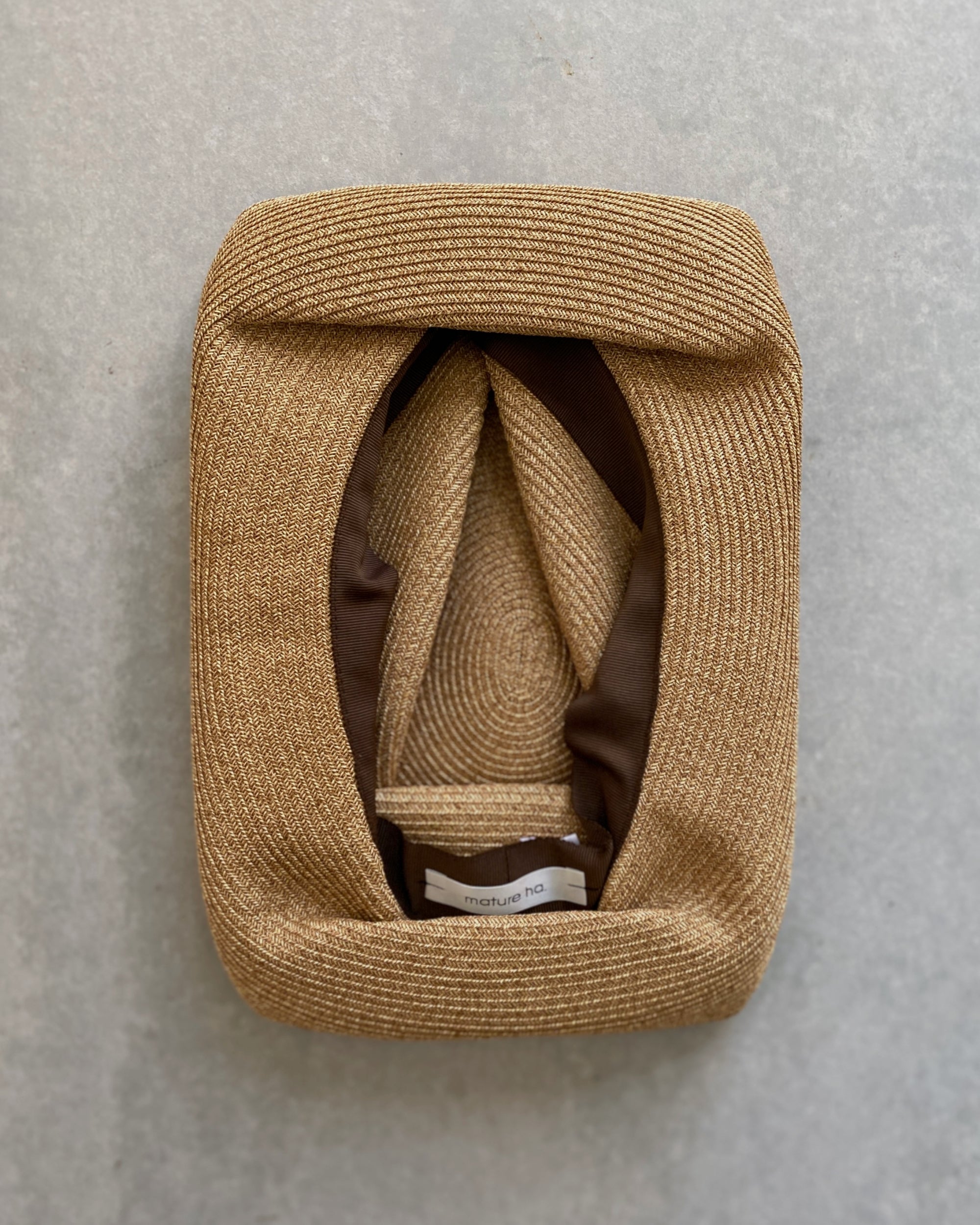 mature ha : boxed hat in sand with carbon ribbon