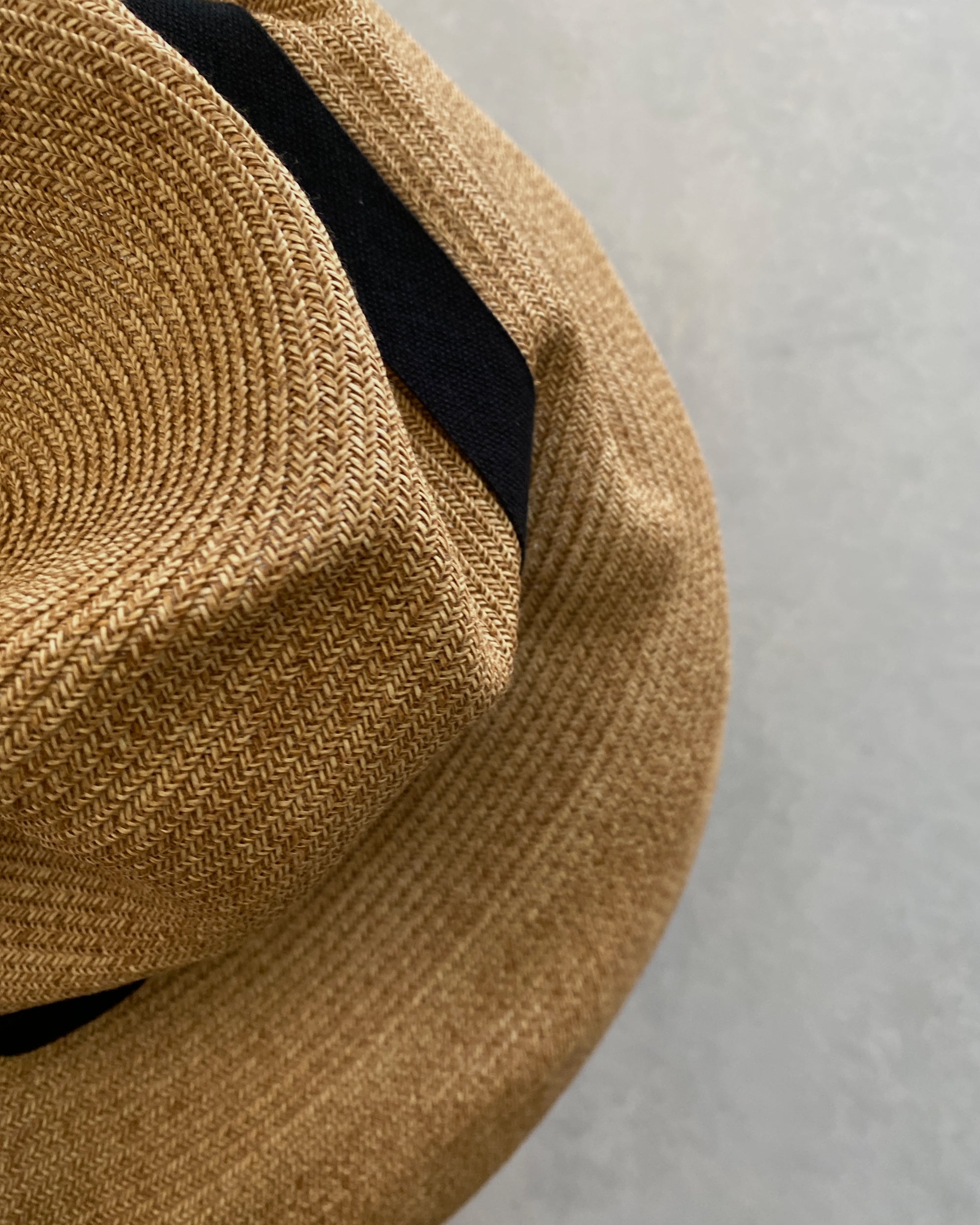 mature ha : boxed hat in sand with carbon ribbon