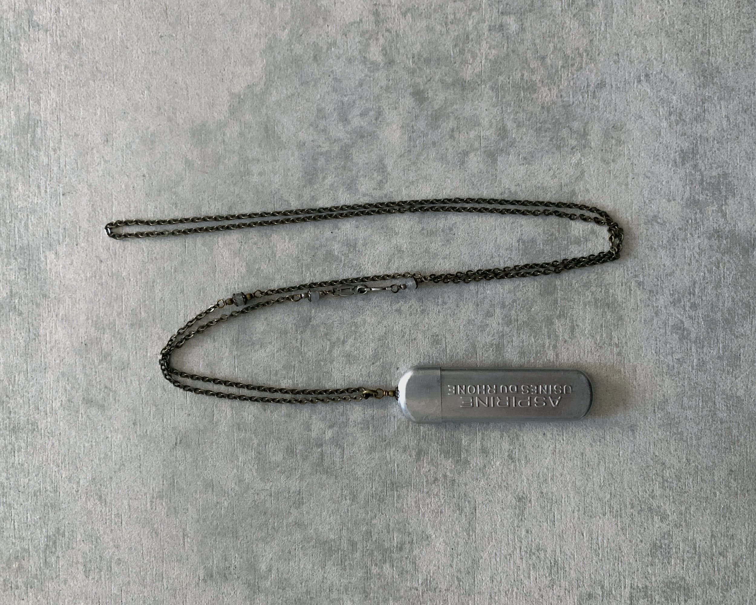 tabito : brass necklace with vintage aspirine case pendant