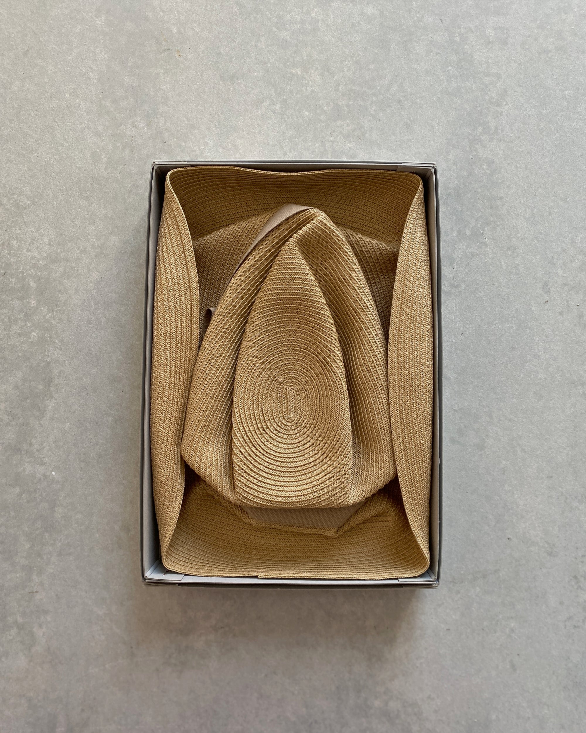 mature ha : boxed hat in sand with vanilla bean ribbon