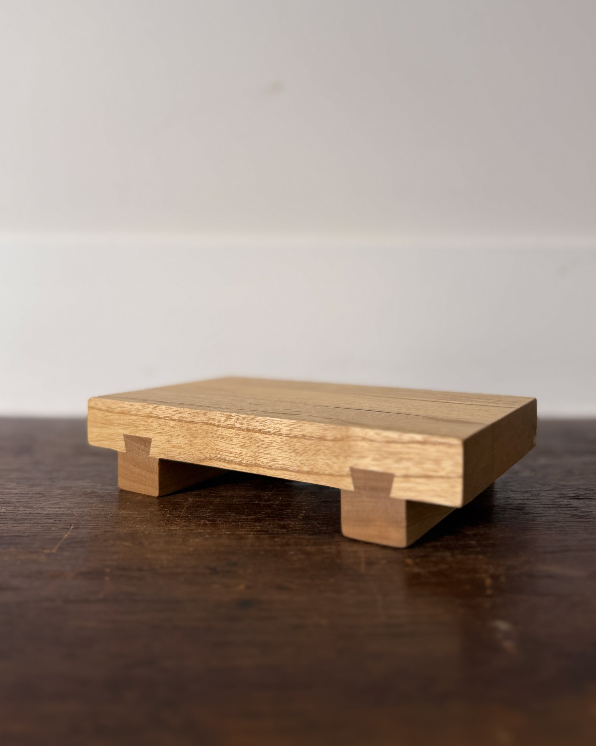 small wooden sushi serving stand