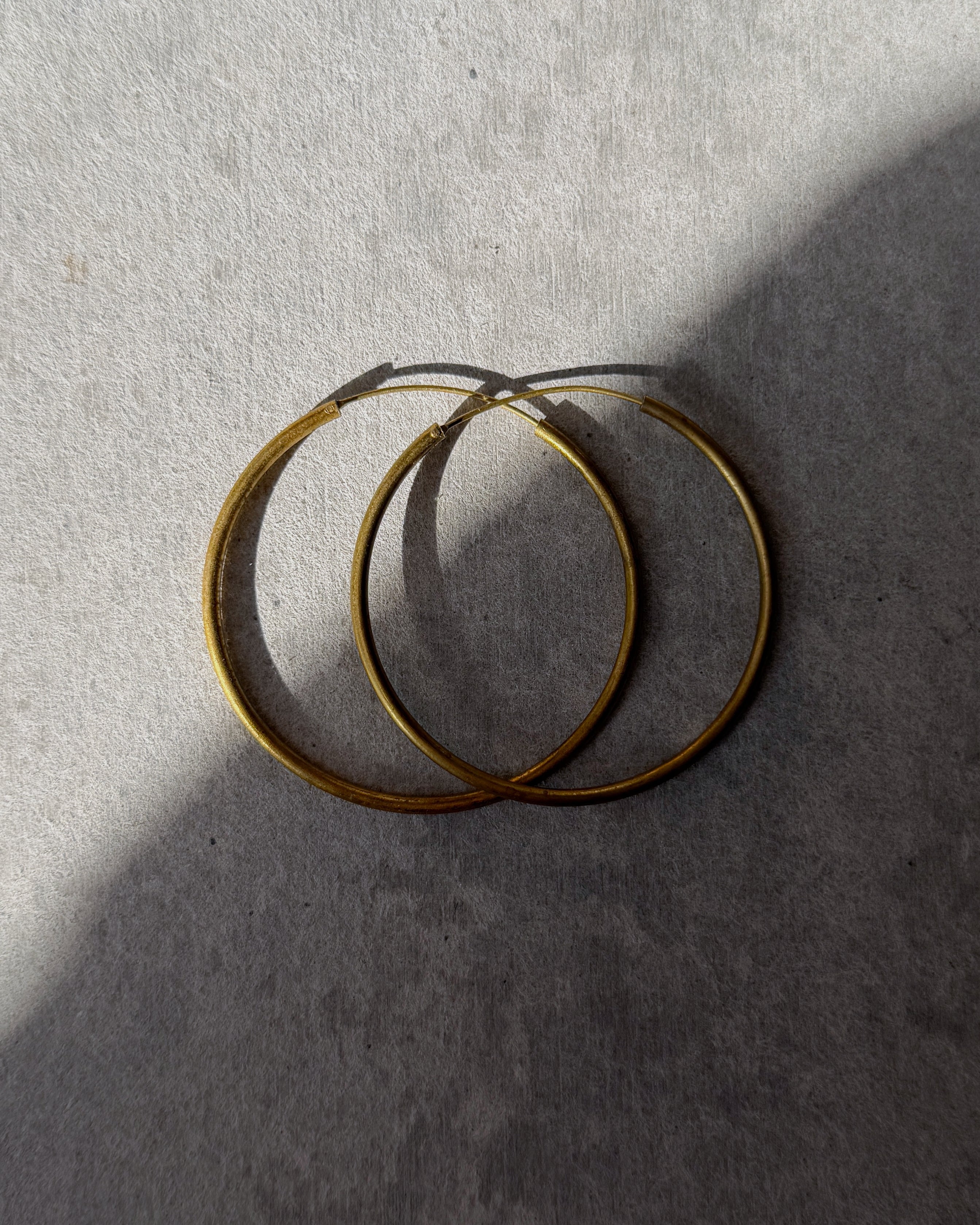 milk-toast : unflappable hoop earrings