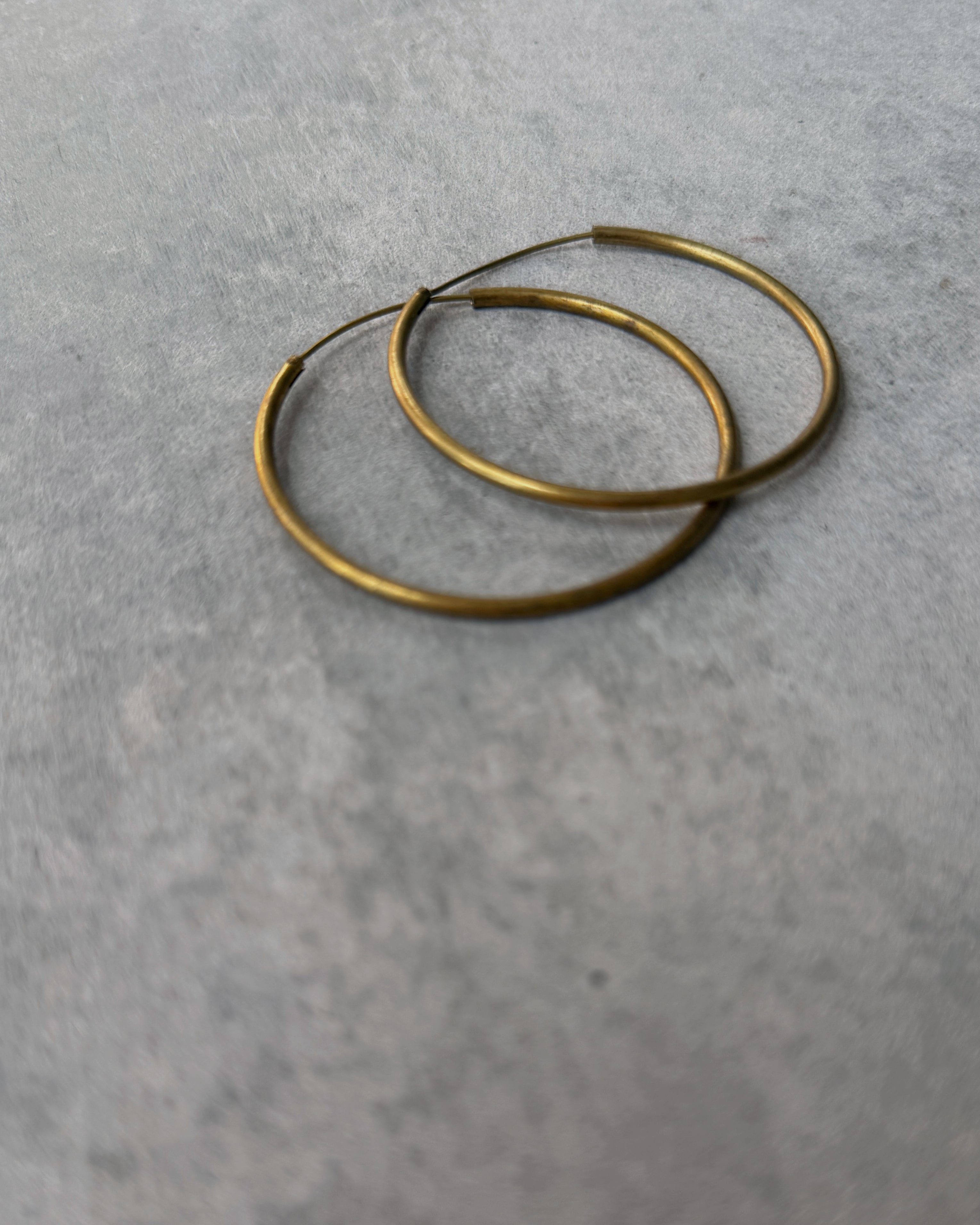 milk-toast : unflappable hoop earrings