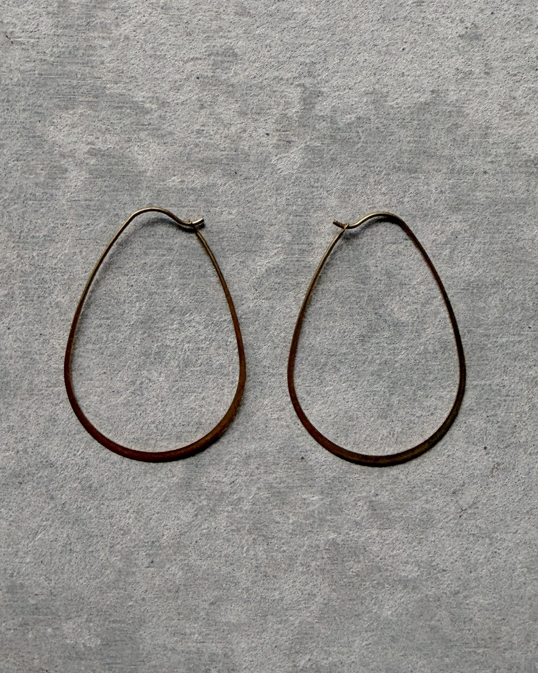 milk-toast : timid hoop earrings