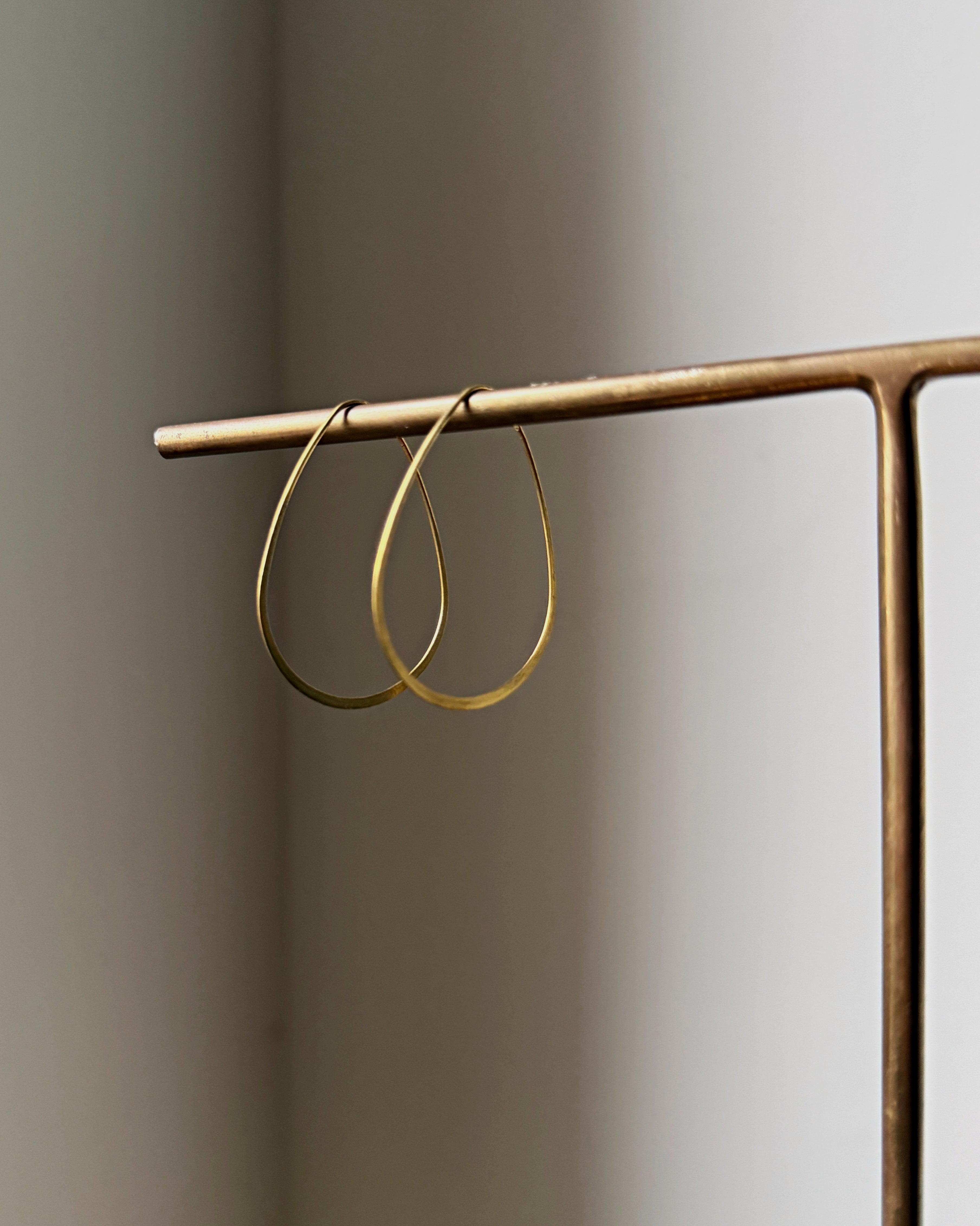milk-toast : timid hoop earrings
