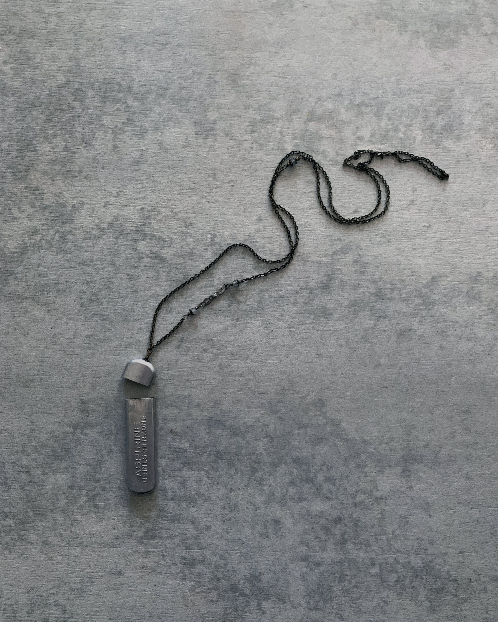 tabito : brass necklace with vintage aspirine case pendant